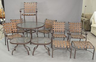 Eleven Piece Woodard Outdoor Set to include a table with glass top, six chairs, two stools, along with two stands, diameter 42 inches.