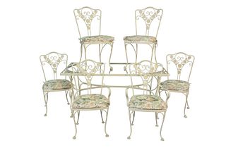 Seven Piece Iron Outdoor Set to include six chairs, two arm and four side; along with a rectangle glass top table, height 29 1/2 inches, top 33" x 61"
