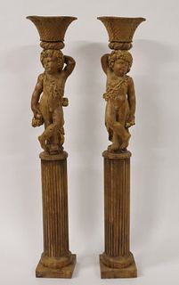 An Antique Pair Of Carved Wood Figural Planters.