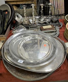 Silver Plated Lot, to include set of four Sheffield silver plated candlesticks; two trays; ice bucket; four trays, two having wood bottoms; along with