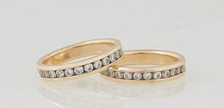 Pair of 14K Yellow Gold Eternity Bands, each with 12 round channel set .05 ct. round diamonds, Size 7, total diamond wt.- 1.2 cts., Size 7, Wt.- .18 T