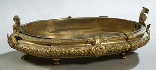 Large Oval Gilt Bronze Table Jardiniere, 19th c., with scrolled relief lions' head handles around a baluster body with relief floral and leaf decorati
