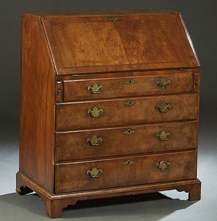 English Inlaid Walnut Slant Front Desk, 19th c., the rectangular top over a lid with an inset tooled leather writing surface in front of a fitted inte