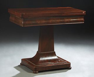American Carved MaAmerican Classical Carved Mahogany Games Table, late 19th c., the swiveling  rounded corner top over game storage, on a tapered squa