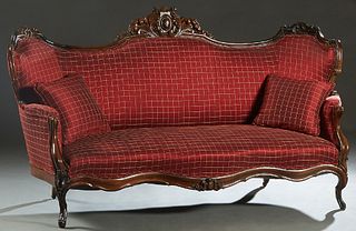 American Carved Mahogany Faux Rosewood Settee, 19th c., the arched curved back with a central carved egg and leaf crest, flanked by scrolled leaf carv