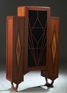 English Art Deco Mahogany and Oak Bookcase, 20th c., with a central geometric mullioned glazed door, flanked by two shorter geometric inlaid narrow do