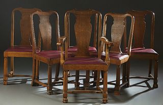 Set of Six (5 +1) Carved Oak Dining Chairs, early 20th c., the arched canted crest rail over a canted back splat to trapezoidal slip seats, on turned 