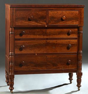 American Classical Carved Mahogany Chest, 19th c., the rectangular top over two frieze drawers and three setback drawers, flanked by applied turned ta