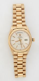 Man's 18K Yellow Gold Rolex Oyster Perpetual Day Date "Presidential" Wristwatch, with an Italian 18K yellow gold link band, running. Provenance: The E