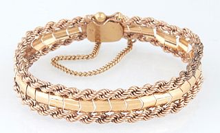 Vintage 18K Yellow and Rose Gold Link Bracelet, with a central curved row of yellow gold links within rope twist borders of rose gold, with a safety c