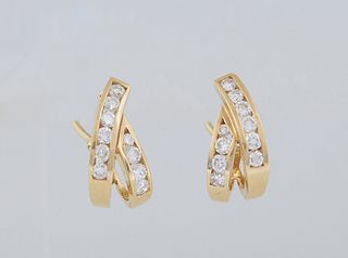 Pair of 18K Yellow Gold Pierced Earrings, with looped crossed bands , each earring with ten bezel set round ten point diamonds, with Omega clasps, tot