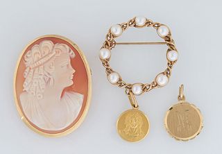 Four Pieces of Vintage Yellow Gold Jewelry, consisting of an 18K religious medallion; an 18K cameo brooch; a 14K circle broach mounted with eight 5mm 