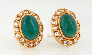 Pair of 18K Yellow Gold Pierced Earrings, with an oval cabochon 12mm x 18mm jade stone atop a conforming border of three sided open boxes, with 15 rou