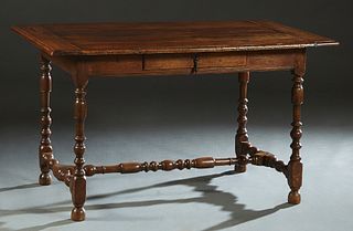English Carved Oak Writing Table, 18th c., the rounded edge top over a frieze drawer, on turned legs joined by a turned H-form stretcher, H.- 29 in., 