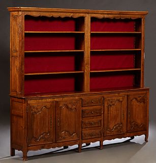 Large French Provincial Carved Cherry Louis XV Style Vaissalier, late 19th c., the stepped rounded corner crown over a back with six open shelves, on 