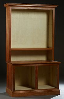 Louisiana Carved Cypress Open Bookcase, 20th c., the stepped crown over adjustable shelves, on a base with two open display areas fitted for adjustabl