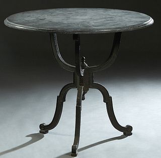 Cast Iron Marble Top Patio Table, 19th c., the stepped ogee edge circular black marble on a tripodal curved yoke support to curved tripodal legs, H.- 