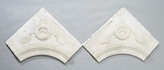 Pair of Carved Marble Architectural Fragments, 19th c., possibly interior fireplace mantel corners, with relief wreath and garland decoration, H.- 27 