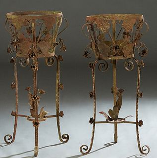 Pair of Cast Iron Plant Holders, 20th/21st c., the circular tops over tapered pierced leaf form sides, to tripodal floral relief legs with scrolled fe