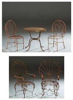 Five Piece Children's Cast Iron Garden Set, 20th/21st c., consisting of a pair of twisted wire fan back armchairs, a pair of side chairs and a circula