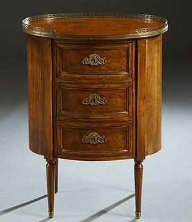 French Louis XVI Style Ormolu Mounted Oval Commode, 20th c., with a pierced brass three-quarter gallery, the case fitted with a bank of three drawers,