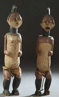 Large Pair of Carved and Polychromed African Dogon Ancestor Figures, 20th c., of a male and female, H.- 50 in., W.- 9 1/2 in., D.- 9 1/2 in. Provenanc