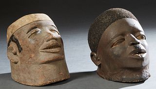Two African Makonde Carved Wood Helmet Masks With Hair, early 20th c., H.- 10 in., W.- 7 1/2 in., D.- 10 1/2 in., and H.- 9 in., W.- 7 1/2 in., D.- 9 