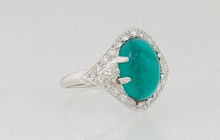Vintage Lady's Platinum Dinner Ring, with an oval cabochon synthetic emerald, atop a curved square border mounted with numerous small round diamonds, 