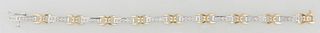 18K White and Yellow Gold Link Bracelet, with nine arched white gold rectangular links, mounted with 5 five point diamonds each, and joined by yellow 
