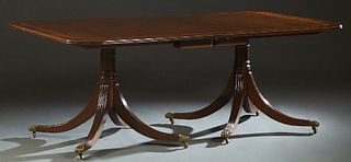 English Inlaid Georgian Style Mahogany Dining Room Table, 20th c., the rounded corner reeded edge top on double turned supports, to four splayed legs 