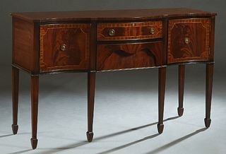 English Inlaid Mahogany Sheraton Style Sideboard, 20th c., the serpentine top over a central bowed frieze drawer above a deep bowed lower drawer, flan