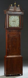 English Inlaid Carved Mahogany Calendar Grandfather Clock, 19th c., the pierced brass finial mounted broken arch crest over a stepped crown above a gl