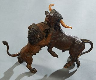 Attr. to Franz Xavier Bergmann (1861-1936, Austrian), "Lion Attacking a Steer," early 20th c., cold painted bronze, with carved ivory horns, unsigned,