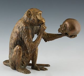 Kolbinger, "Monkey Philosophizing over a Skull," 20th c., gilt bronze, impressed signature on proper right side, behind the leg, H.- 9 1/4 in., W.- 6 