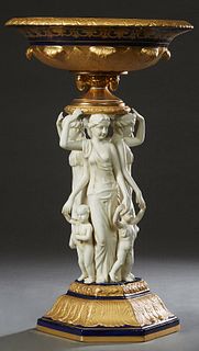 Sevres Style Porcelain Figural Centerpiece Bowl, 20th/21st c., the gilt decorated cobalt banded bowl on figural supports of four classical maidens, ea