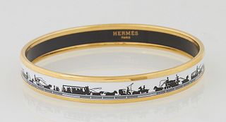 Hermes Narrow White Enamel Bracelet, with horse and carriage decoration, marked "Hermes Paris," H.- 3/8 in., Dia.- 2 1/2 in. Provenance: The Estate of