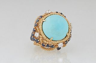 Lady's 18K Yellow Gold Dinner Ring, with a cabochon circular app 8 carat Persian turquoise, atop a twisted gold border over pierced swirling sides mou