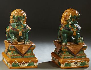 Pair of Large Chinese Glazed Terra Cotta Foo Dogs on Stands, 20th c., H.- 31 in., W.- 16 in., D.- 19 1/2 in., Provenance: Acquired in Singapore c. 198