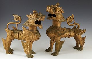 Pair of Chinese Bronze Foo Lions, 19th c., now in gold paint, Taller- H.- 13 in., W.- 10 1/2 in., D.- 7 in.