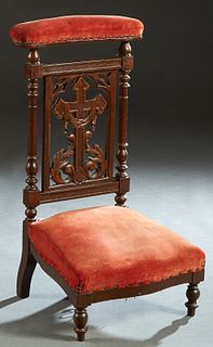 French Carved Beech Prie Dieu, late 19th c./early 20th c., the padded armrest over a cruciform back splat, to a trapezoidal bowed seat, on turned tape