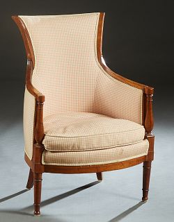 Directoire Style Carved Cherry Bergere, early 20th c., the canted curved back over curved arms and a bowed removable cushion seat, on ring turned tape