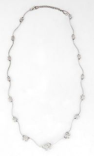 14K White Gold Link Necklace, each of the 15 curved ribbon links joined by a graduated diamond mounted butterfly link, with a safety chain, L.- 16 in.