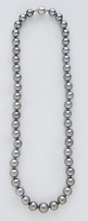 Graduated Strand of Gray Cultured Pearls, ranging from 7-10mm, with an 18K white gold ball clasp, L.- 16 in. Provenance: The Estate of Dr. Sue LeBlanc