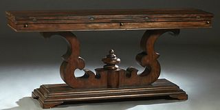 Unusual Carved Mahogany Flip Top Sofa Table, 20th/21st c., the top with front and back fold out leaves, on a large central scrolled trestle support, o