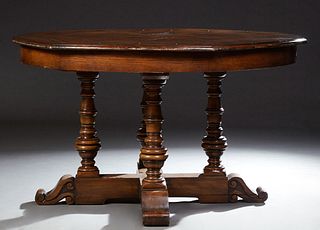 Unusual Carved Oak Circular Expandable Robert Jupe Style Dining Table, 20th c., by DeWitt Designs, the rounded edge circular top with fold out leaves,