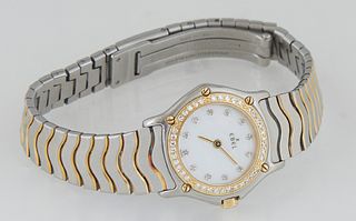 Lady's Ebel Stainless Steel Wristwatch, 20th c., reference 1057902, No. 181026570, with diamond chapter marks, a mother-of-pearl face and an 18K yello