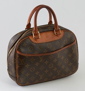 Louis Vuitton Brown Monogram Coated Canvas Trouville Handbag, the exterior with an open pouch and vachetta leather trimming and handles, the zipper op