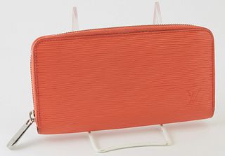Louis Vuitton Coral Orange Zippy Wallet, the calf leather epi with a silver accent zipper, opening to two card holders, a zip pouch, and three bill co