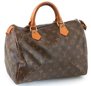 Louis Vuitton Brown Monogram Coated Canvas 30 Speedy Handbag, with golden brass hardware and vachetta leather handles, opening to a brown canvas lined