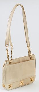 Vintage Chanel Triple Logo Chain Beige Calf Leather Shoulder Bag, c. 2019, with gold hardware, the exterior of the bag with two open pockets on either
